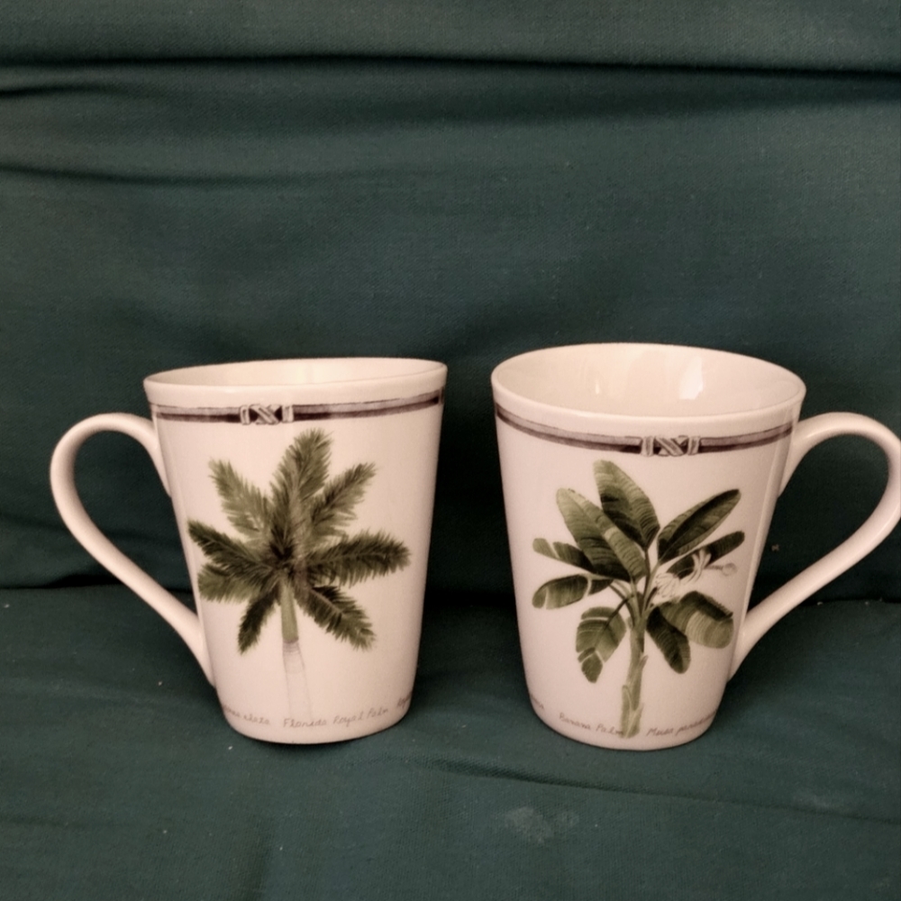 Coastal mugs, diff. names & palm trees on each. 2 mugs for $11.00.